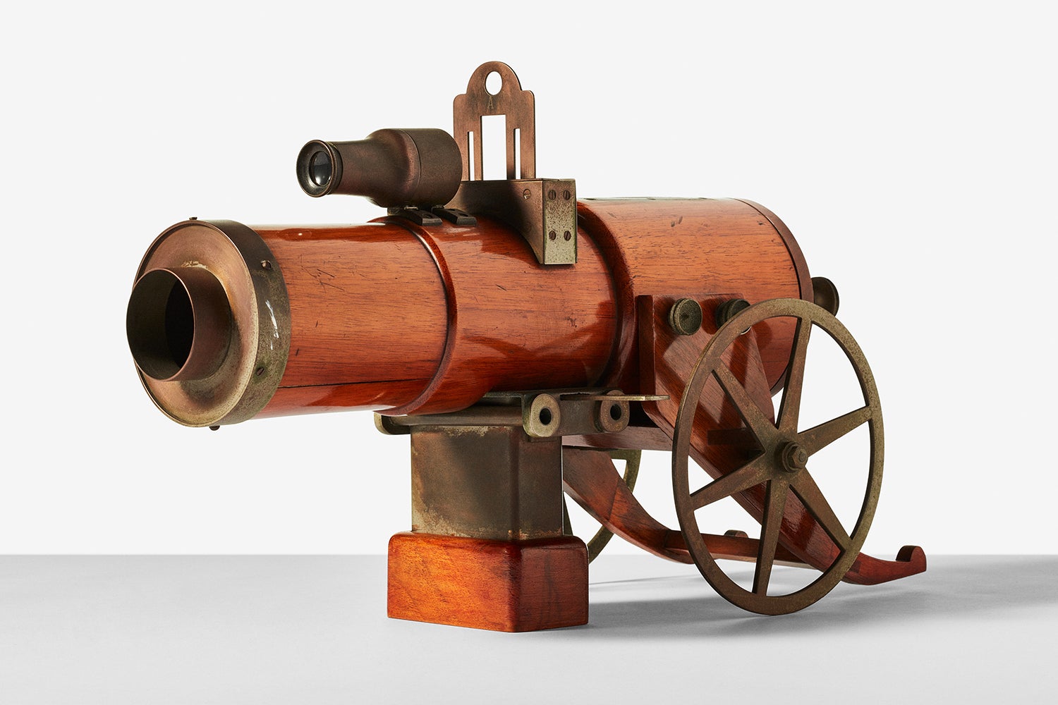 a vintage camera that looks like a gun, isolated on a background