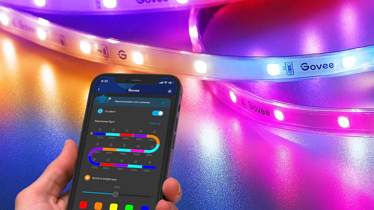 Govee smart LED strip lights lit up in different colors with the control app in the foreground