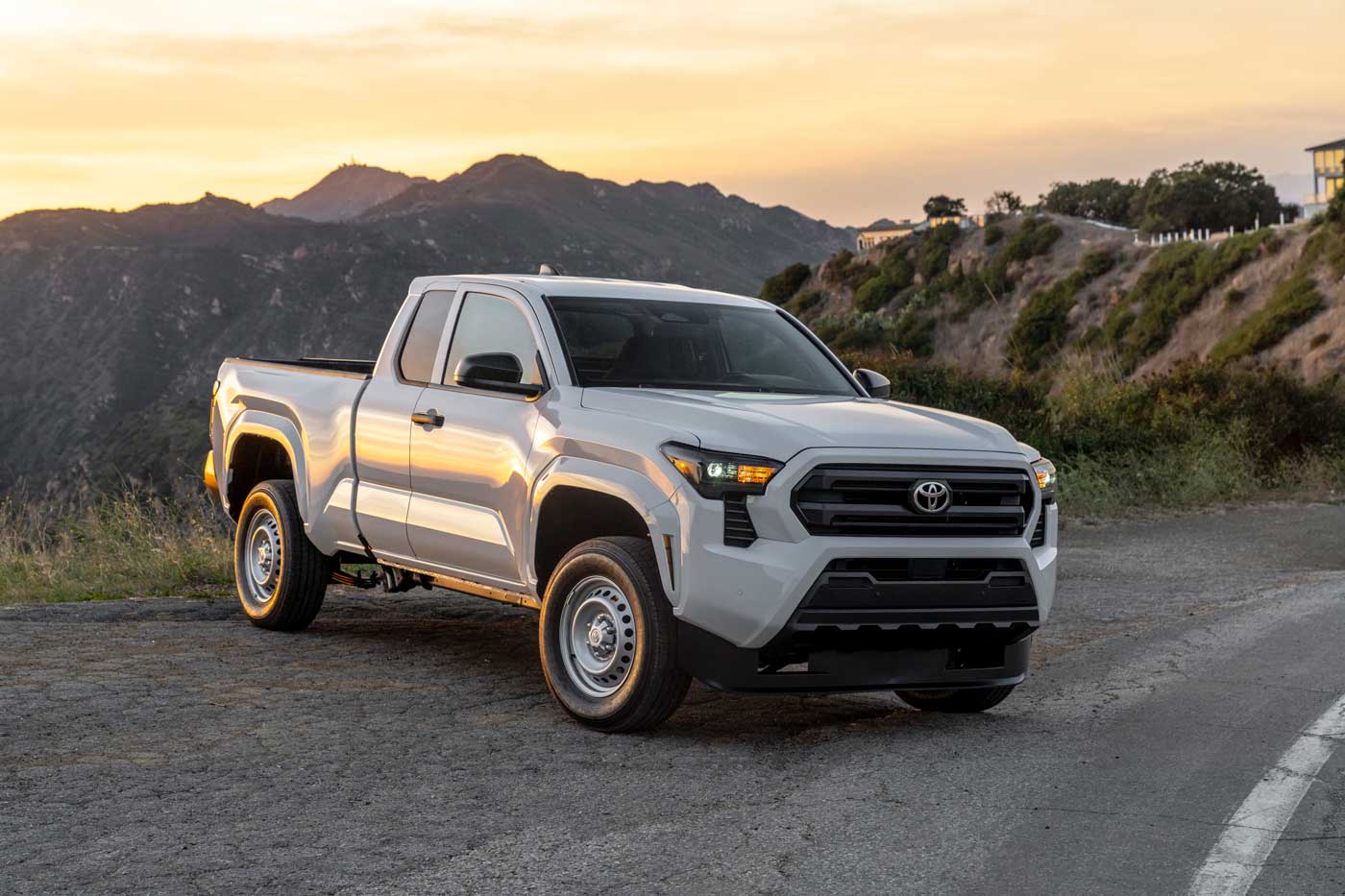 2024 Toyota Tacoma pickup truck first drive: White truck on the side of the road at sunset