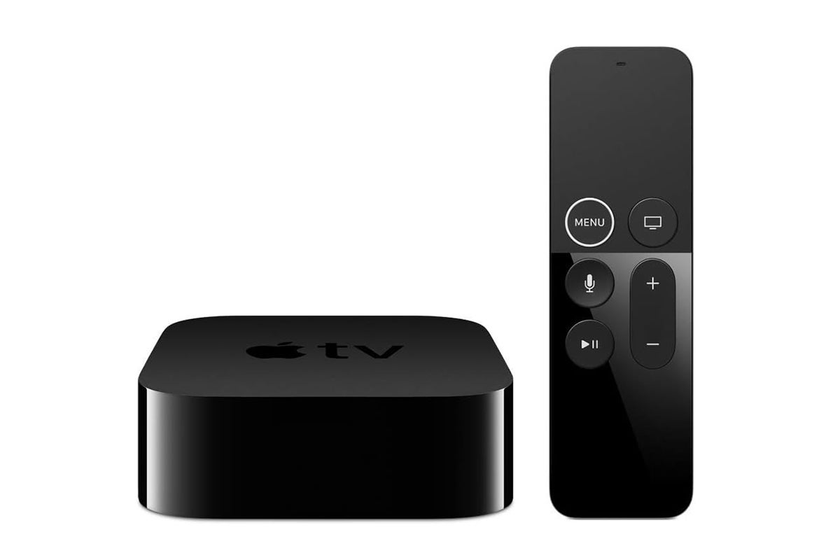 An Apple TV with Siri remote on a plain background
