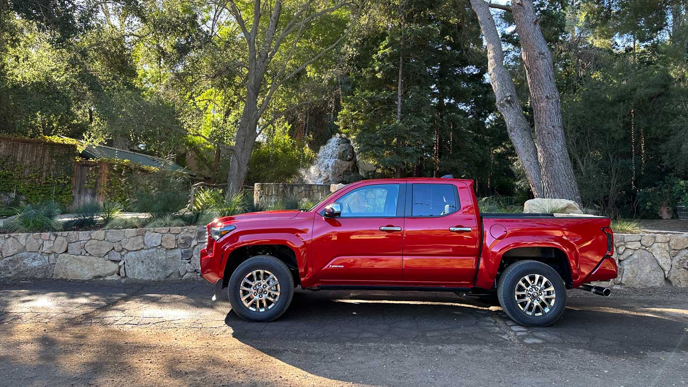 2024 Toyota Tacoma pickup truck first drive: A profile view of a red truck