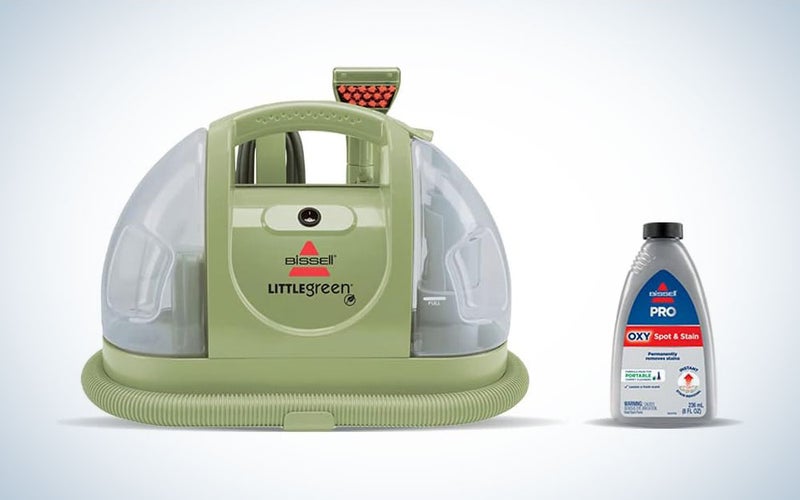 A Bissell Little Green carpet cleaner on a plain background