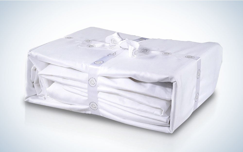 A white Delilah Home sheet set tied up in a rectangle on a plain background
