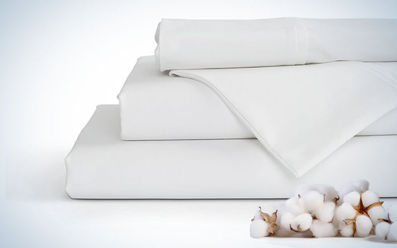 A pair of White linen home store sheets on a plain background