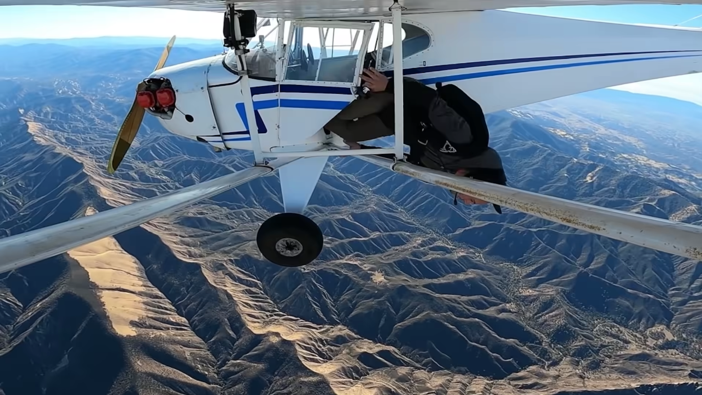 Trevor Jacob jumping out of plane midair over mountains
