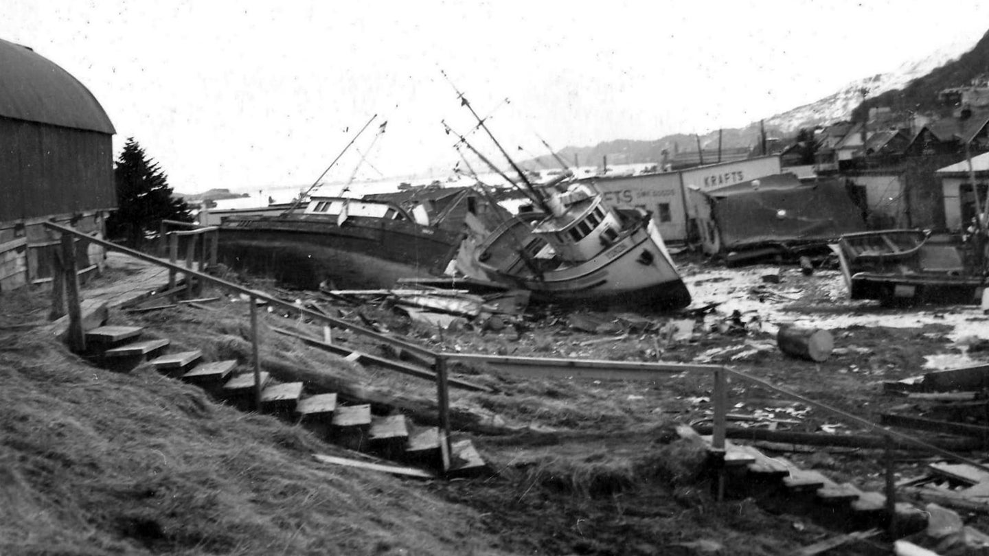 A photo from the 1964 Kodiak National Wildlife Refuge annual report shows damage near a small harbor after the Good Friday Earthquake. More than 20 tsunamis struck Alaska in all, killing 106 people across the state and causing $284 million in damage.