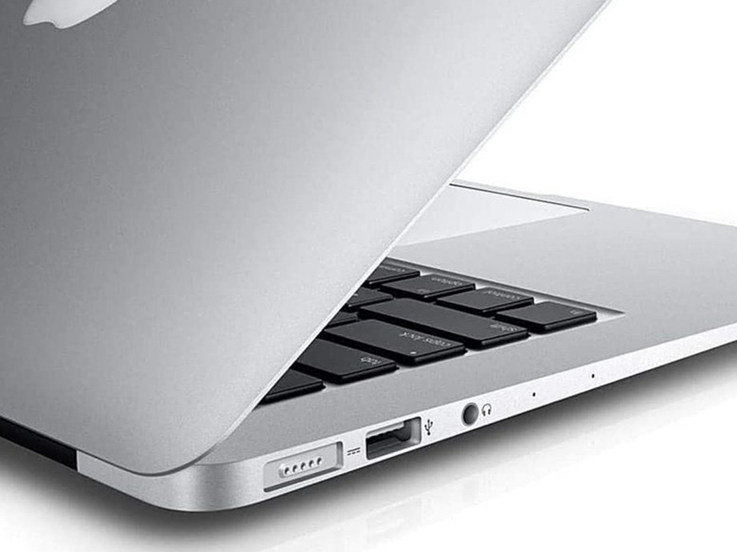 A refurbished Macbook Air on a plain background