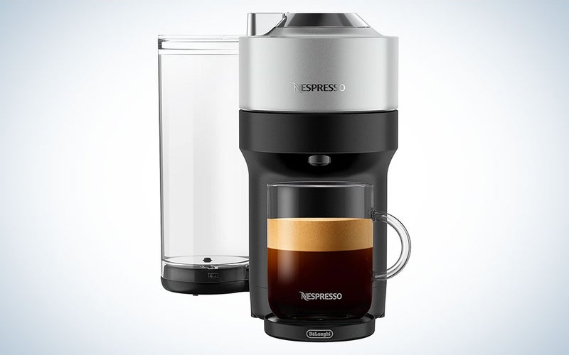A Nespresso Vertuo Pop+ Deluxe Coffee and Espresso Machine by De'Longhi on a plain background