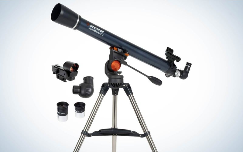Celestron Astromaster 70AZ budget telescope with accessories on a plain background
