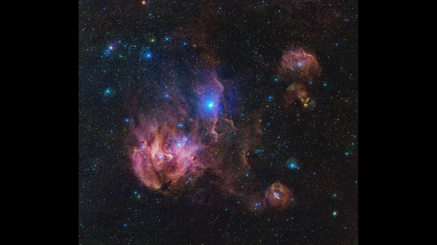 The Running Chicken Nebula comprises several clouds, all of which we can see in this vast image from the VLT Survey Telescope. The clouds shown in wispy pink plumes are full of gas and dust, illuminated by the young and hot stars within them.