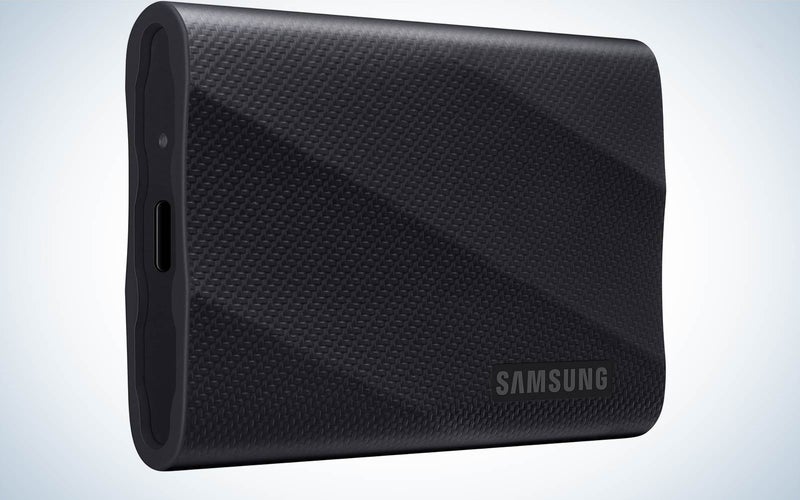 A samsung T9 portable SSD on a plain background