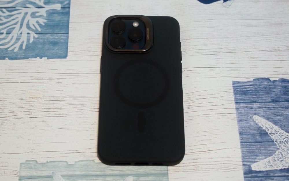 A black ESR Silicone Case With Kickstand on a table