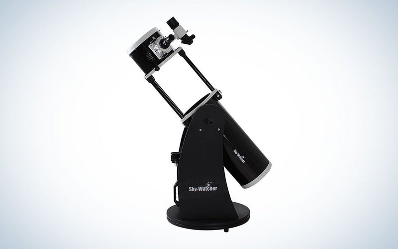 A black Sky-Watcher 8 with Auto-guiding systems