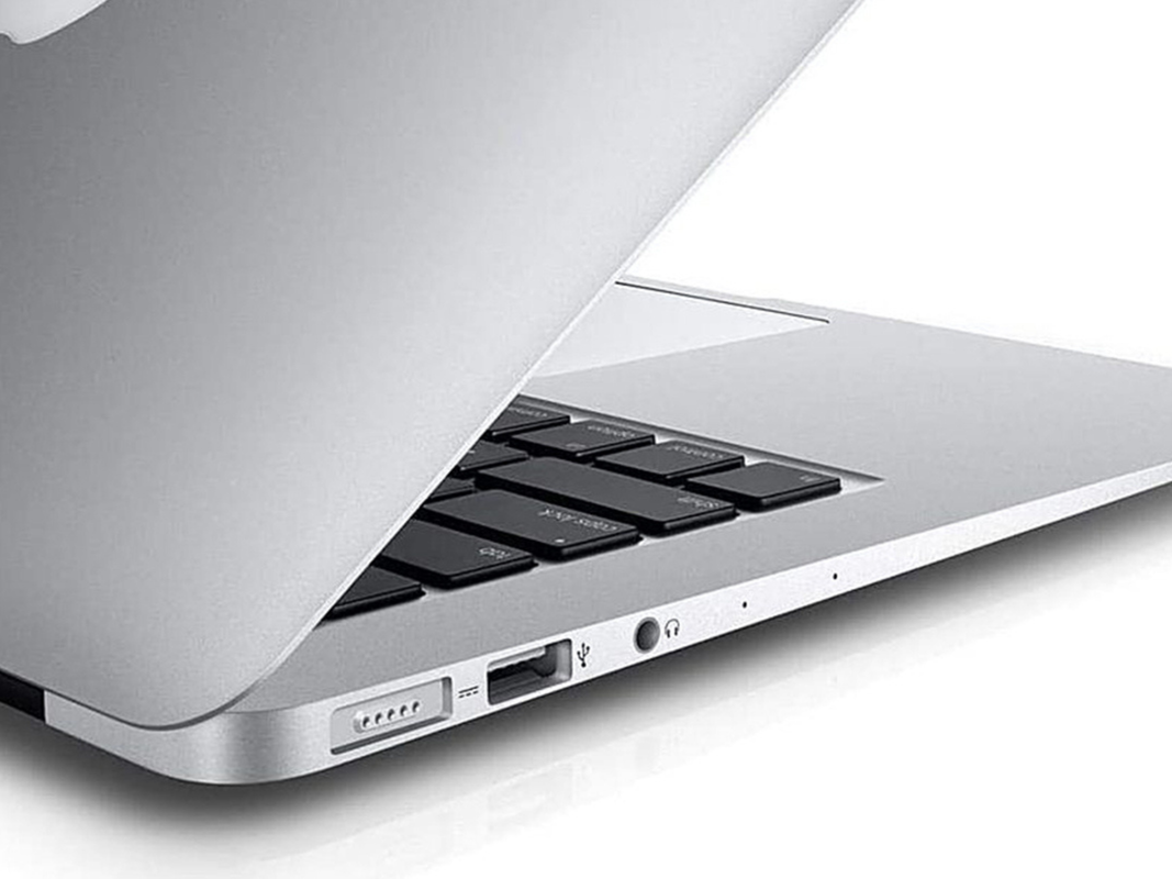 A 2017 silver Macbook Air on a plain background