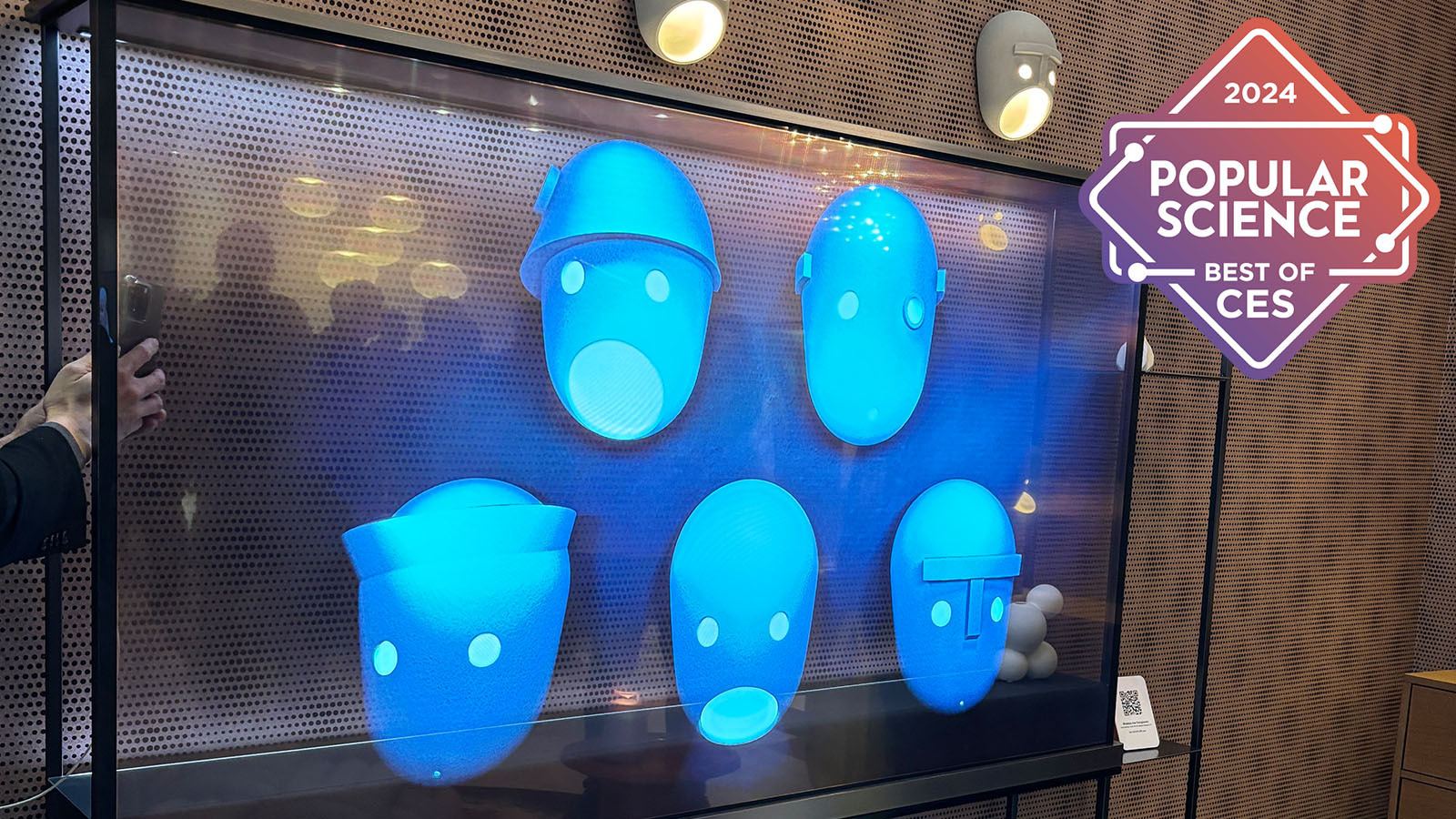 The LG Signature transparent TV with weird blue heads on the screen