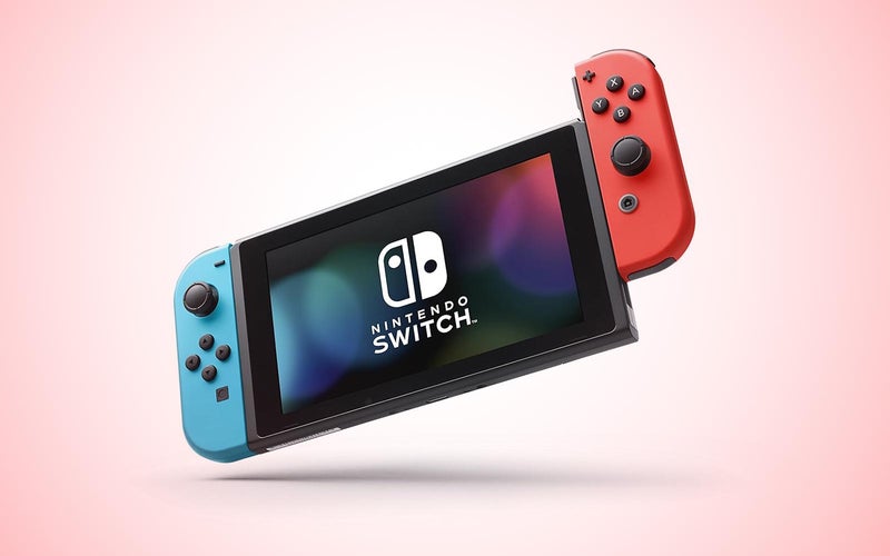 Nintendo Switch on a plain background with one Joy Con partly off