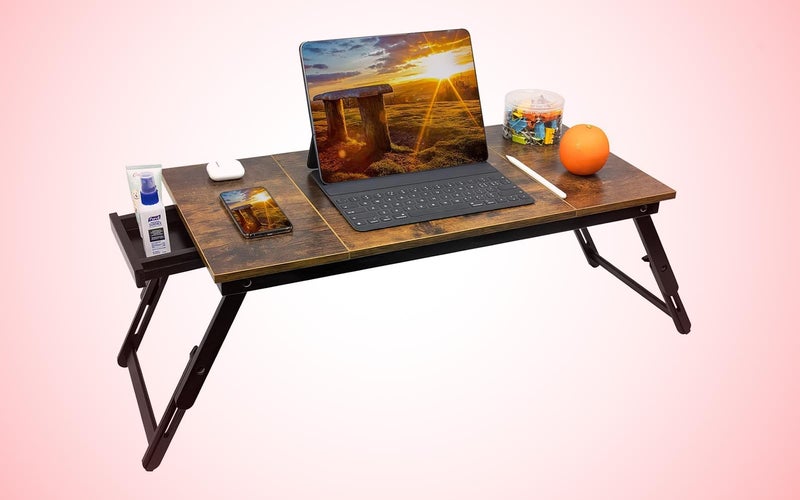 The JMLHMXC tray table with a laptop and accessories
