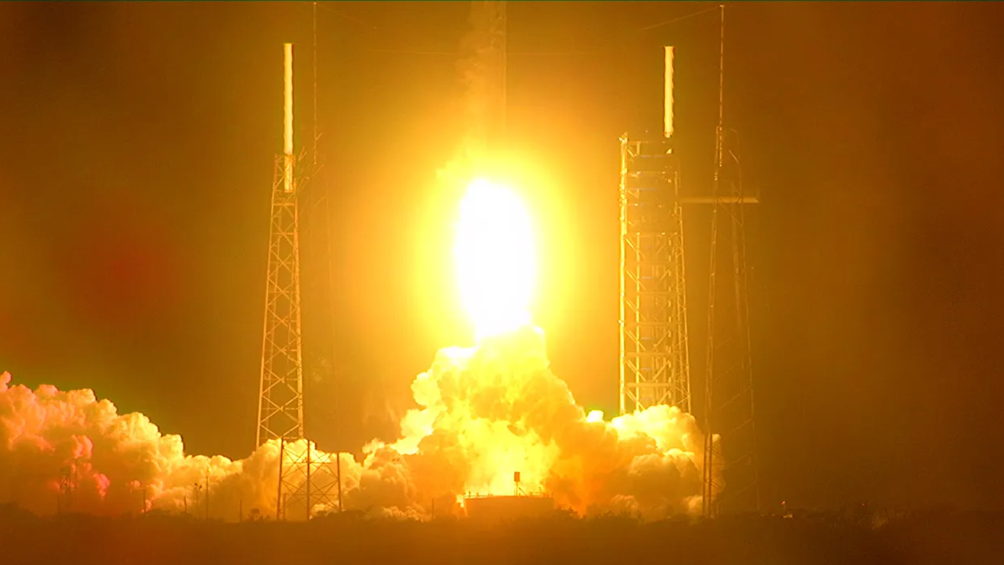 NASA’s Plankton, Aerosol, Climate, ocean Ecosystem (PACE) satellite launches aboard a SpaceX Falcon 9 rocket. Fire and smoke are below the spacecraft as it lifts off from the launch pad.