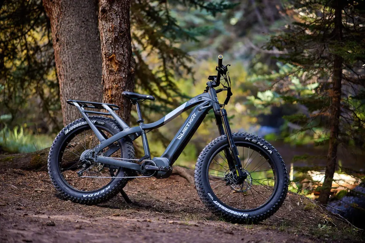 Quietkat Apex Pro fat tire electric bike in a pine forest