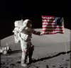 An astronaut salutes the american flag