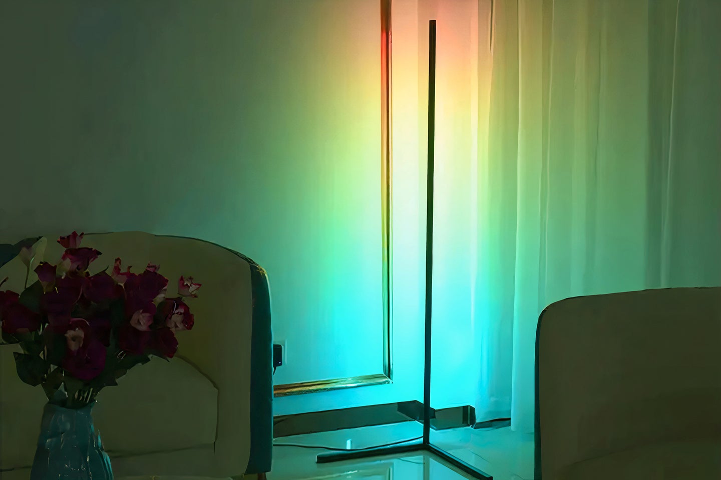 A LED corner lamp shines a rainbow-colored light on a blank wall
