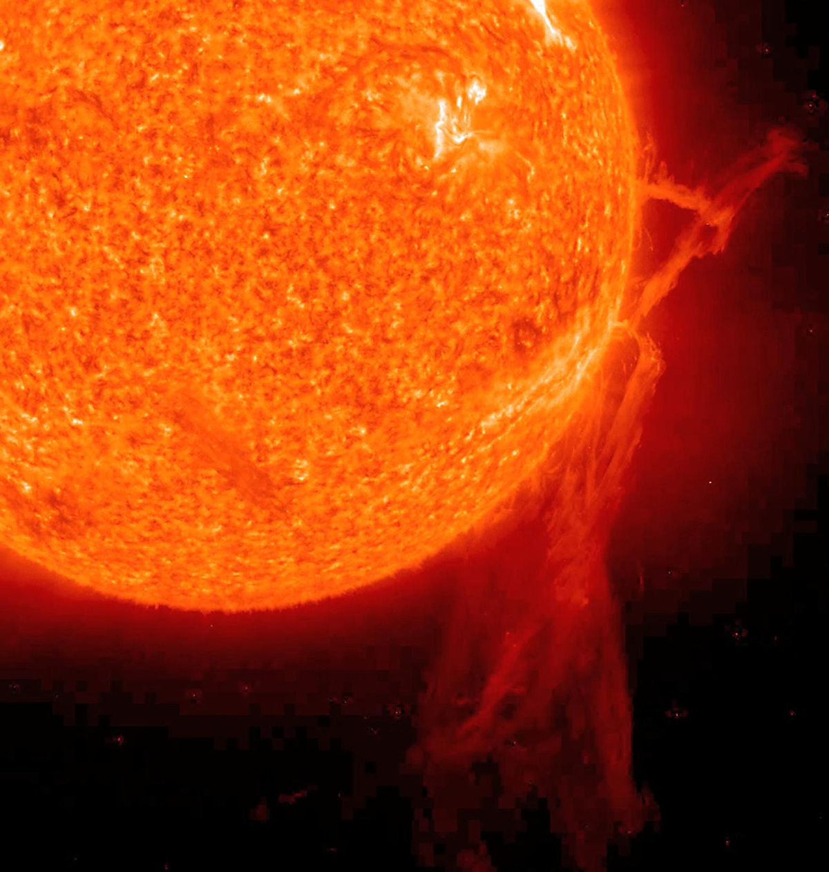 A very long solar filament that had been snaking around the Sun erupted (Dec. 6, 2010) with a flourish. STEREO (Behind) caught the action in dramatic detail in extreme ultraviolet light of Helium. It had been almost a million km long (about half a solar radius) and a prominent feature on the Sun visible over two weeks earlier before it rotated out of view. Filaments, elongated clouds of cooler gases suspended above the Sun by magnetic forces, are rather unstable and often break away from the Sun. Credit: NASA/GSFC/SOHO NASA