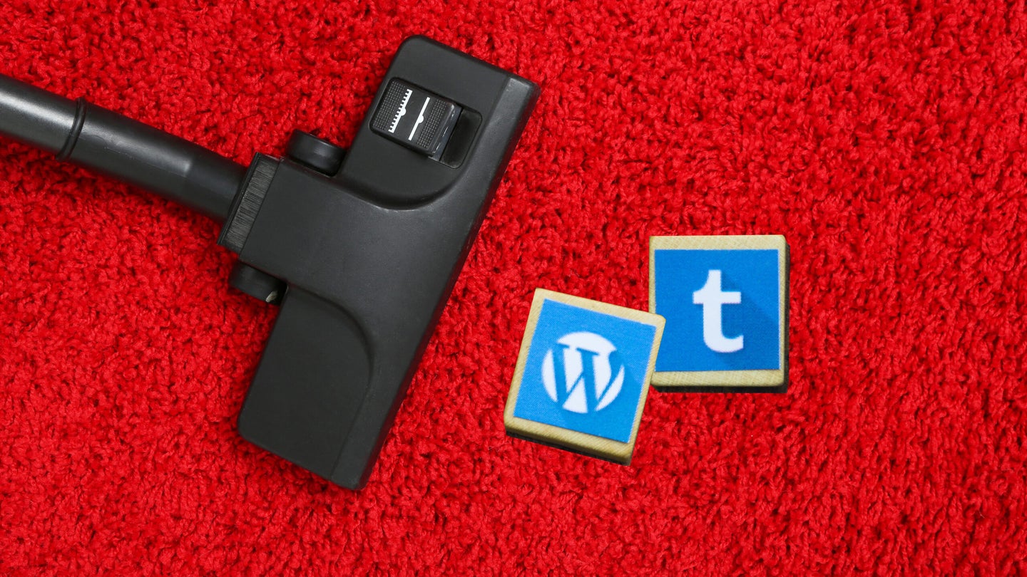 Vacuum moving towards two blocks with Wordpress and Tumblr logos