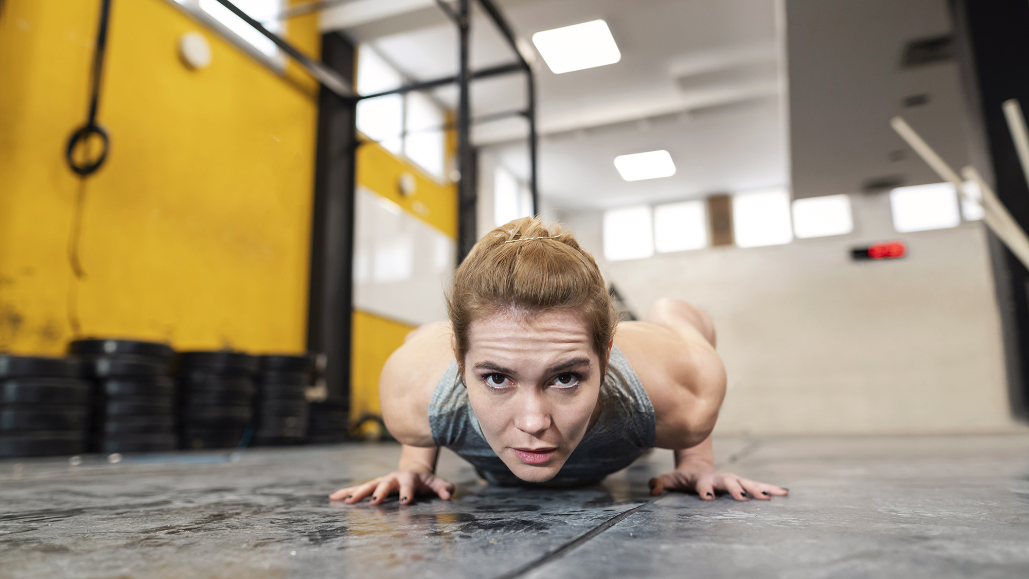 a woman in a pushup position on the floor