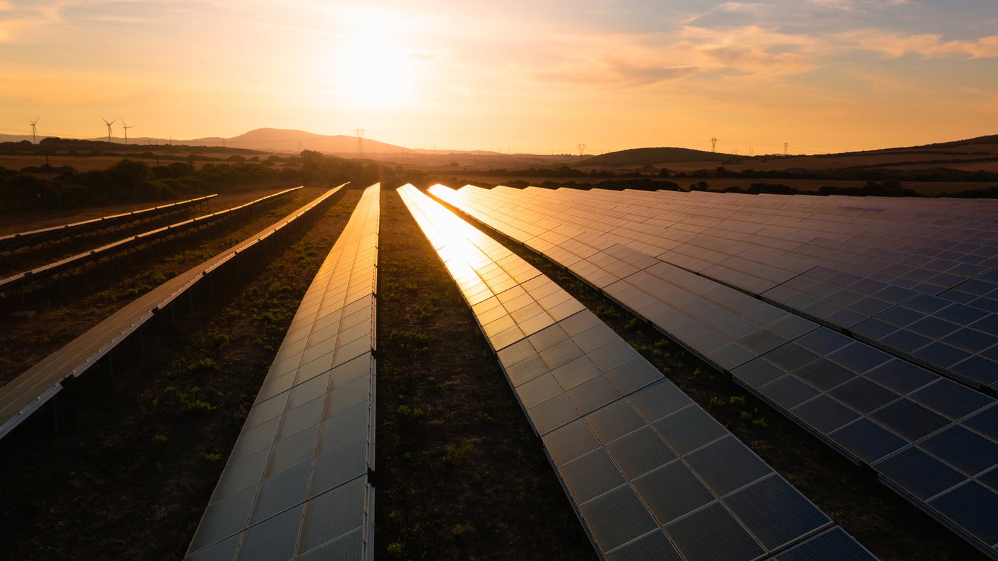 solar power farm at sunset