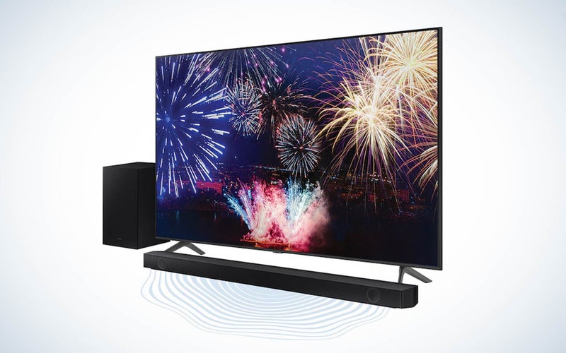 Samsung 75-inch TV and soundbar with sound waves coming out of the speaker on a plain background