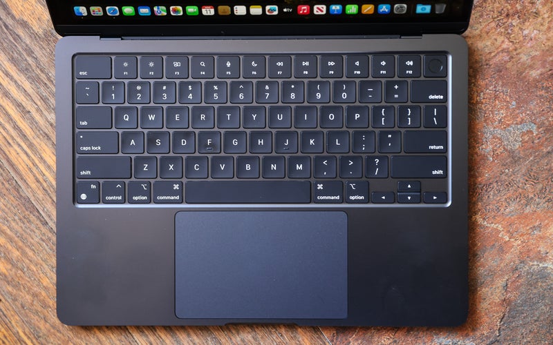 MacBookAir M3 keyboard on a wood surface
