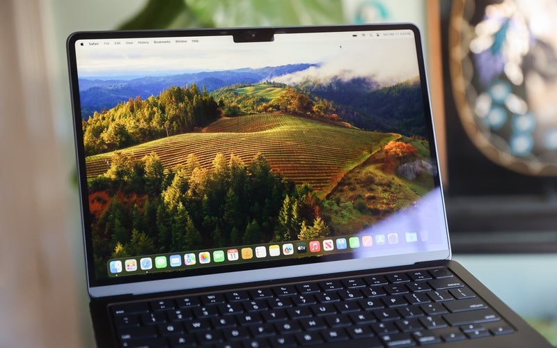 The MacBook Air M3 on its homescreen with a blurry background