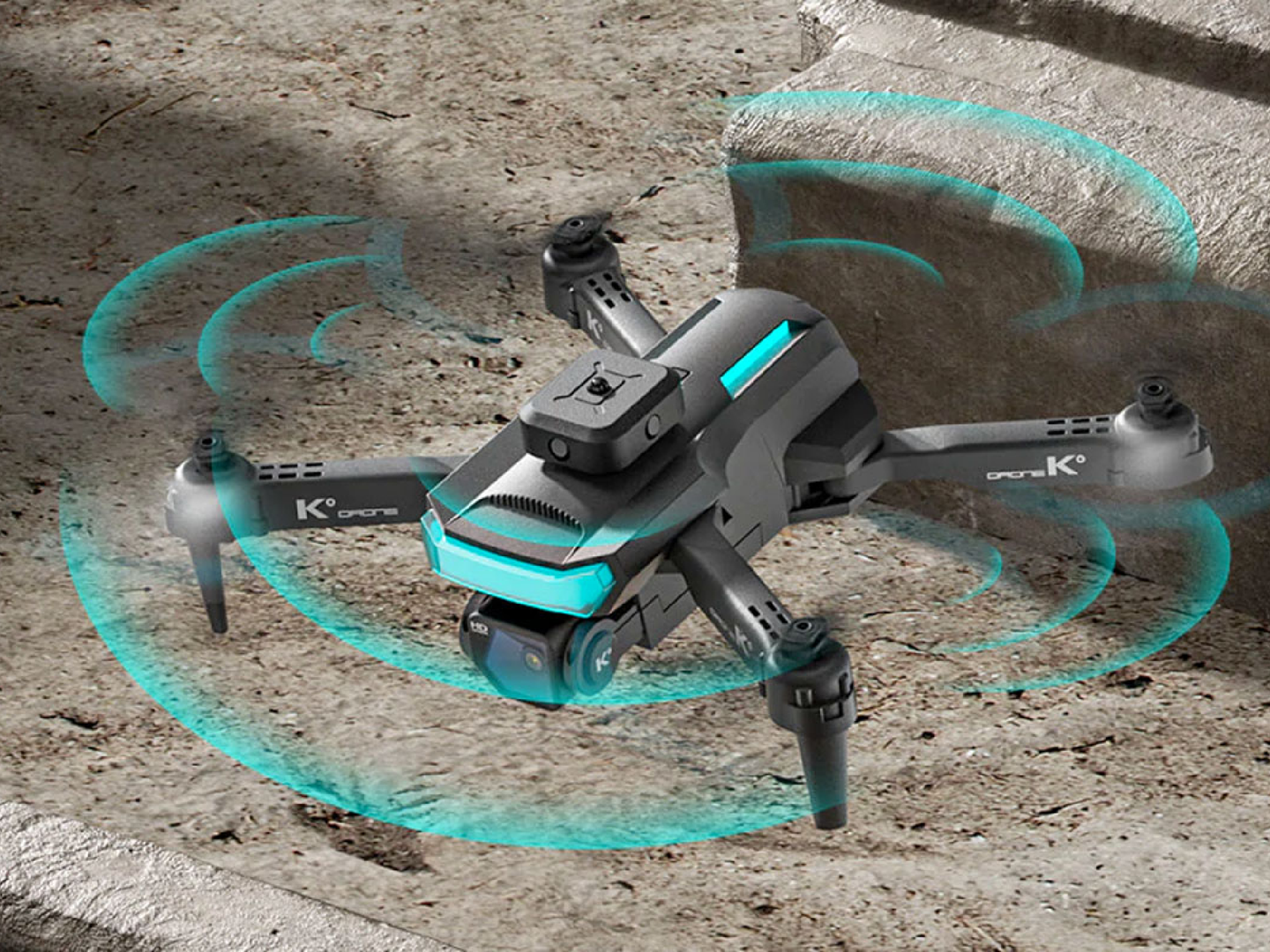 A quad-copter, dual-camera drone flying over on a rocky surface.
