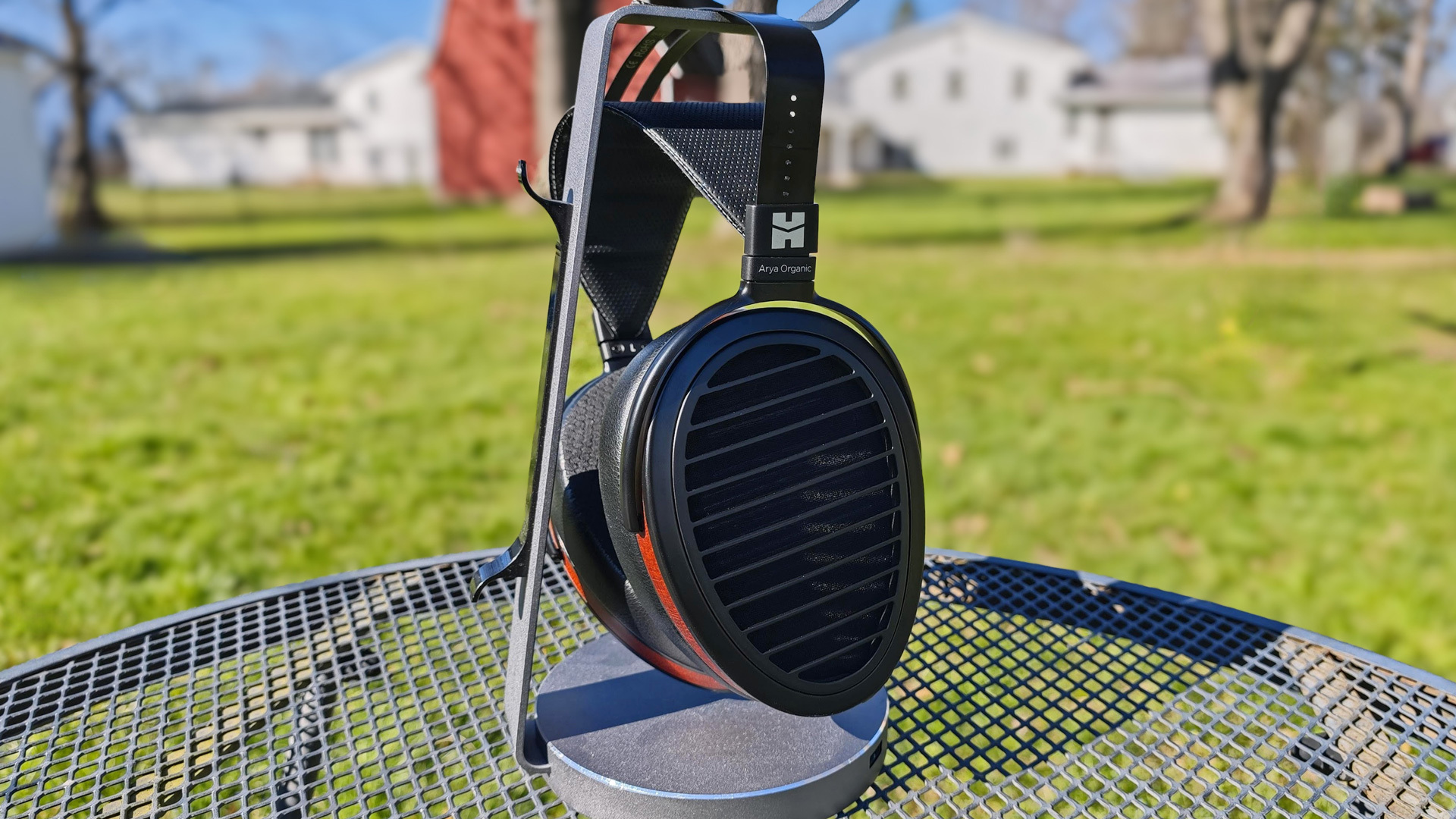 HiFiMAN-Arya-Organic headphones outside on a stand.