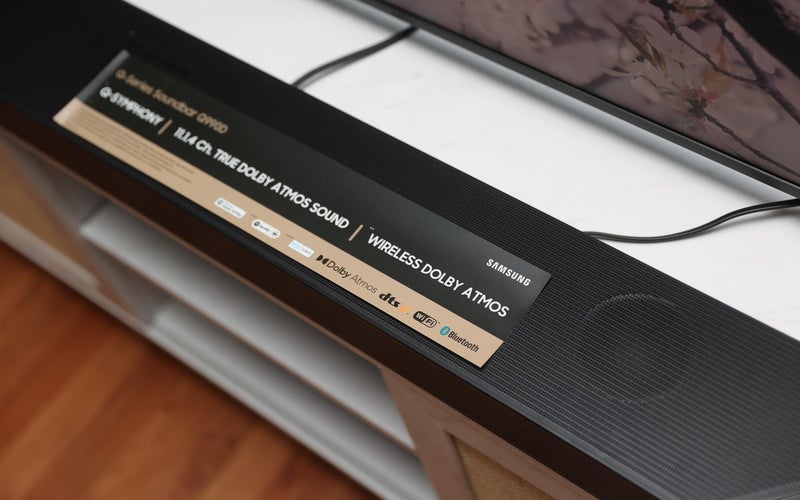 Samsung 990D soundbar in front of a TV