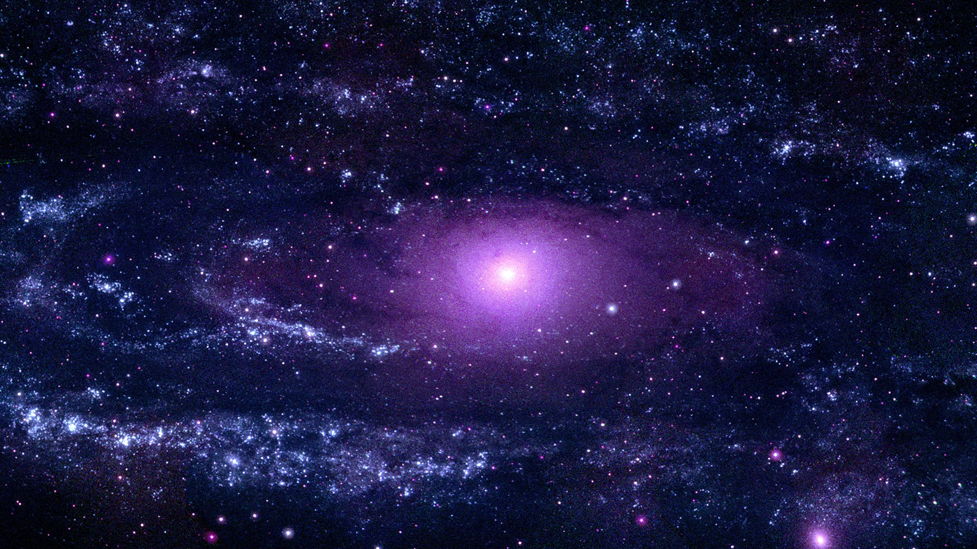 a swirling, purple galaxy in space