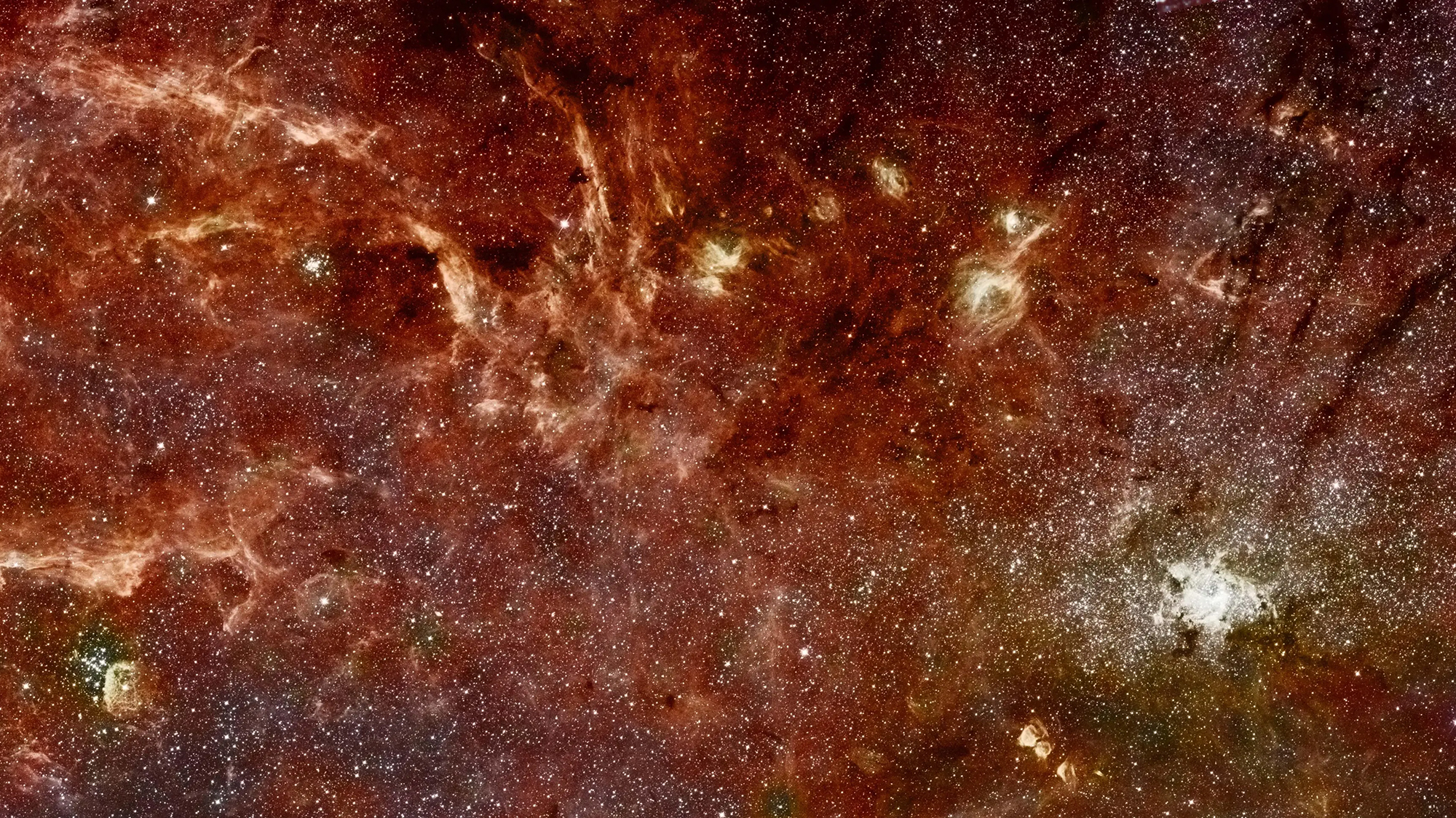 An image of the core of our Milky Way galaxy. This view combines the sharp imaging of Hubble’s Near Infrared Camera and Multi-Object Spectrometer (NICMOS) with color imagery from a previous Spitzer Space Telescope survey done with its Infrared Astronomy Camera (IRAC).
