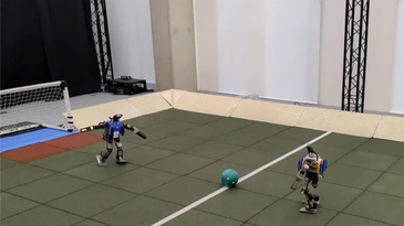 Watch two tiny, AI-powered robots play soccer