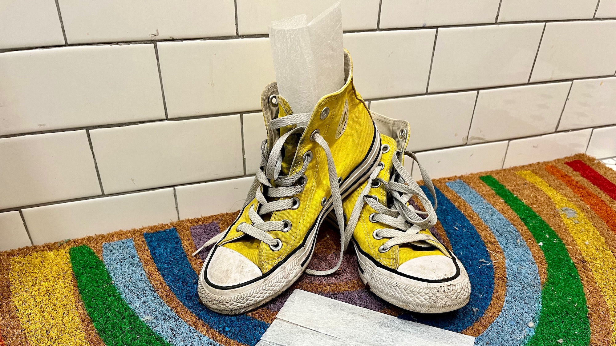 dryer sheet inside a yellow shoe