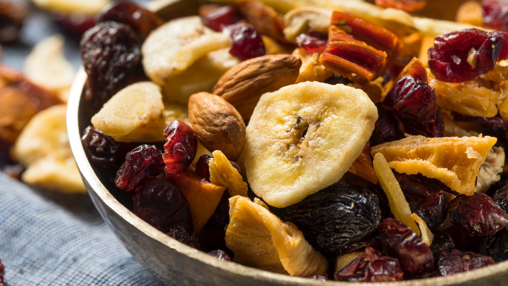 a bowl of nuts, dried fruit