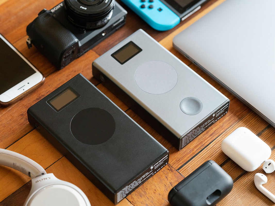 Two power banks surrounded by various devices