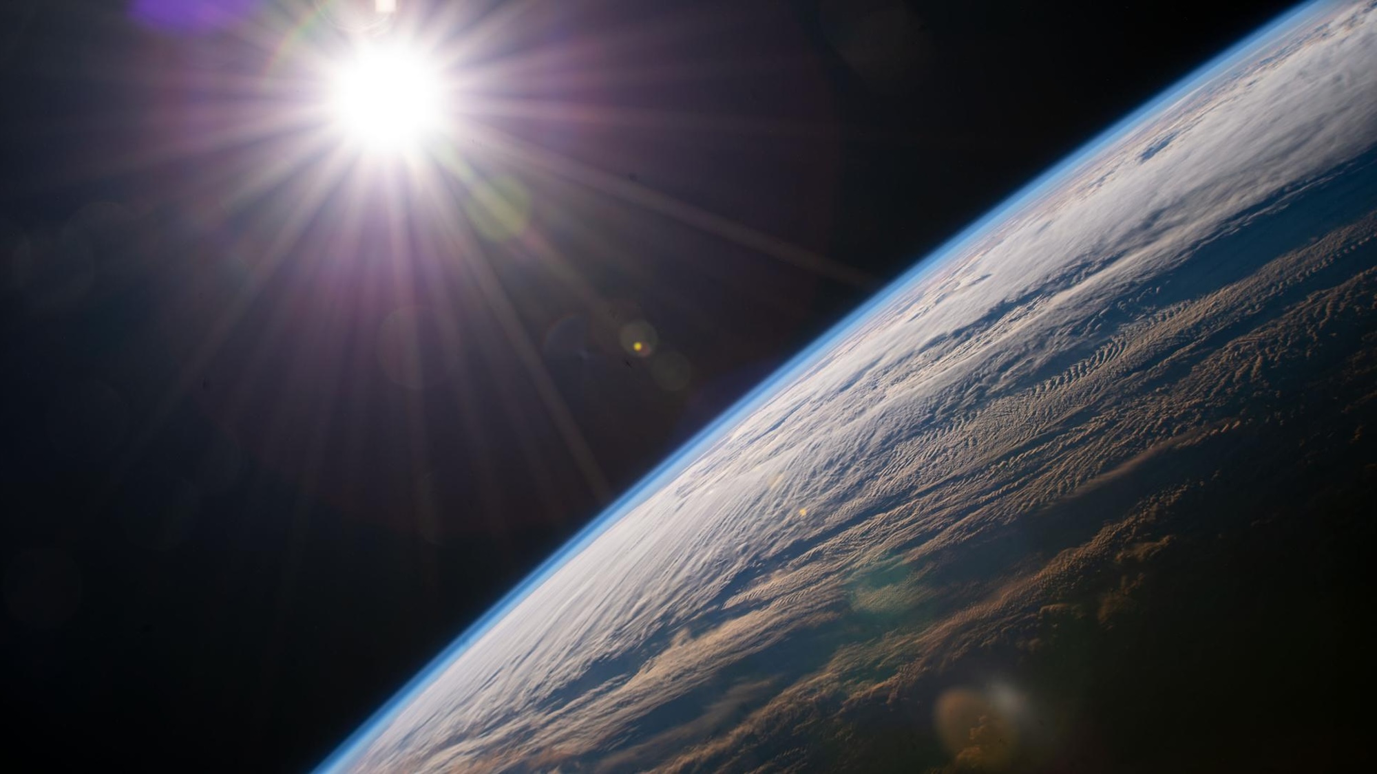 Sun above earth photo taken from ISS