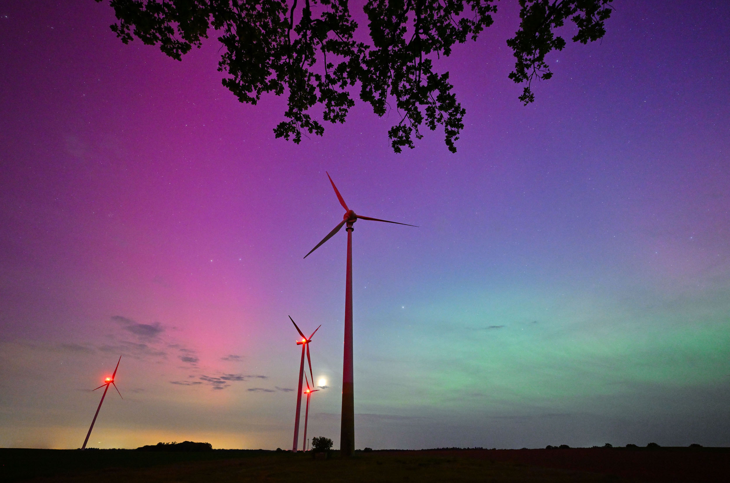 aurora on the background of wind turbines