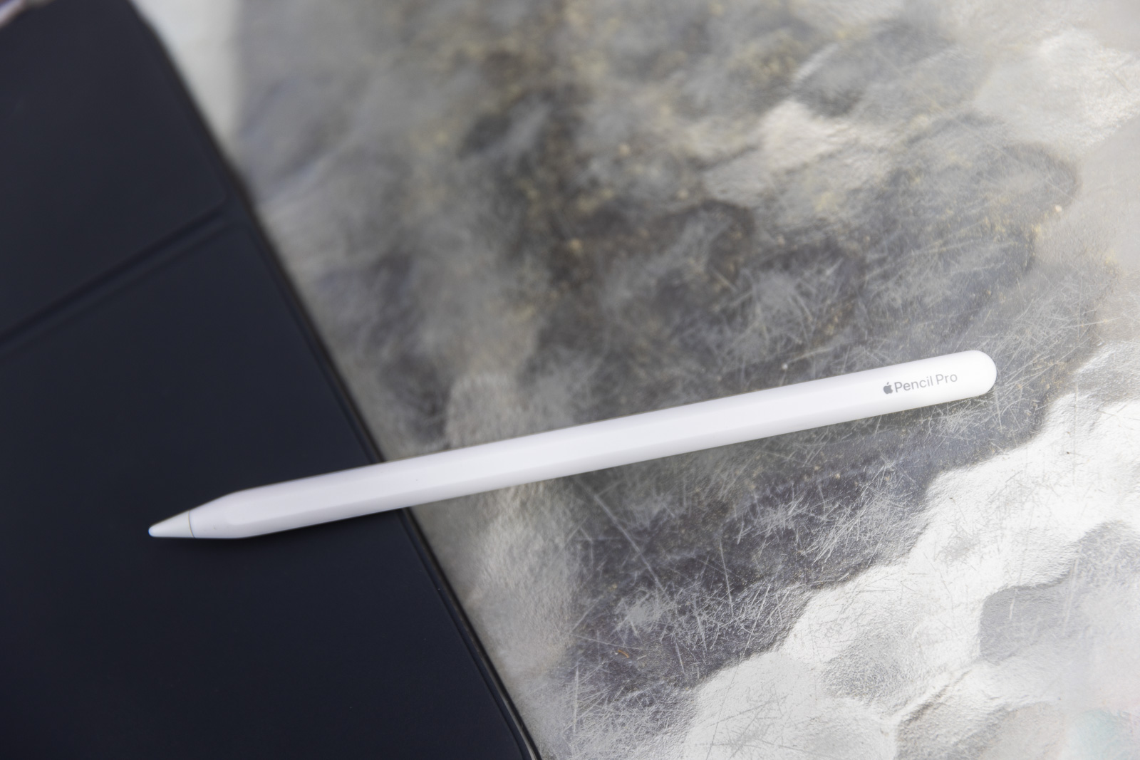 Apple Pencil Pro laying on a table