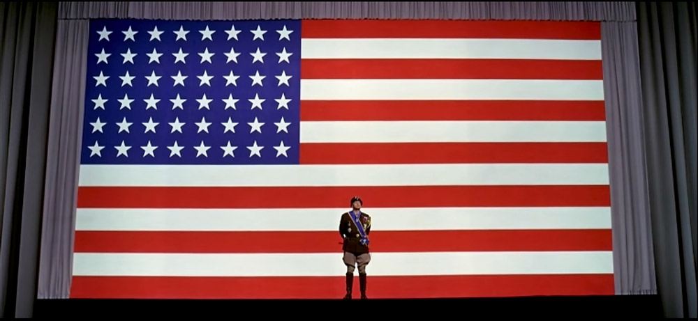 A men with a US flag in background