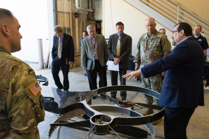 People looking at hovercraft