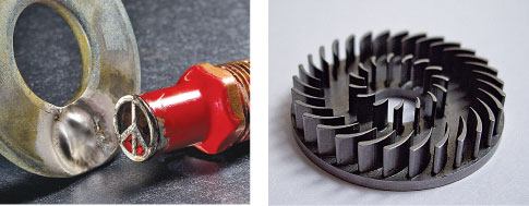 On the left, a steel washer and a small peace-sign earring made out of tin. On the right, a round, carved piece of metal that's a microturbine for a water pump.