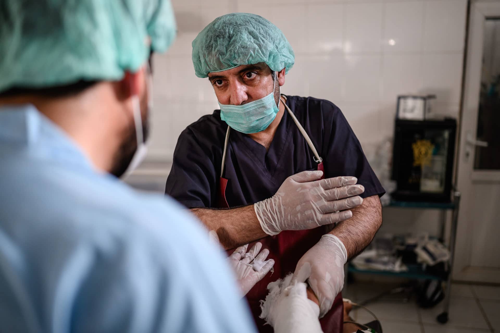 a doctor giving a nurse instructions