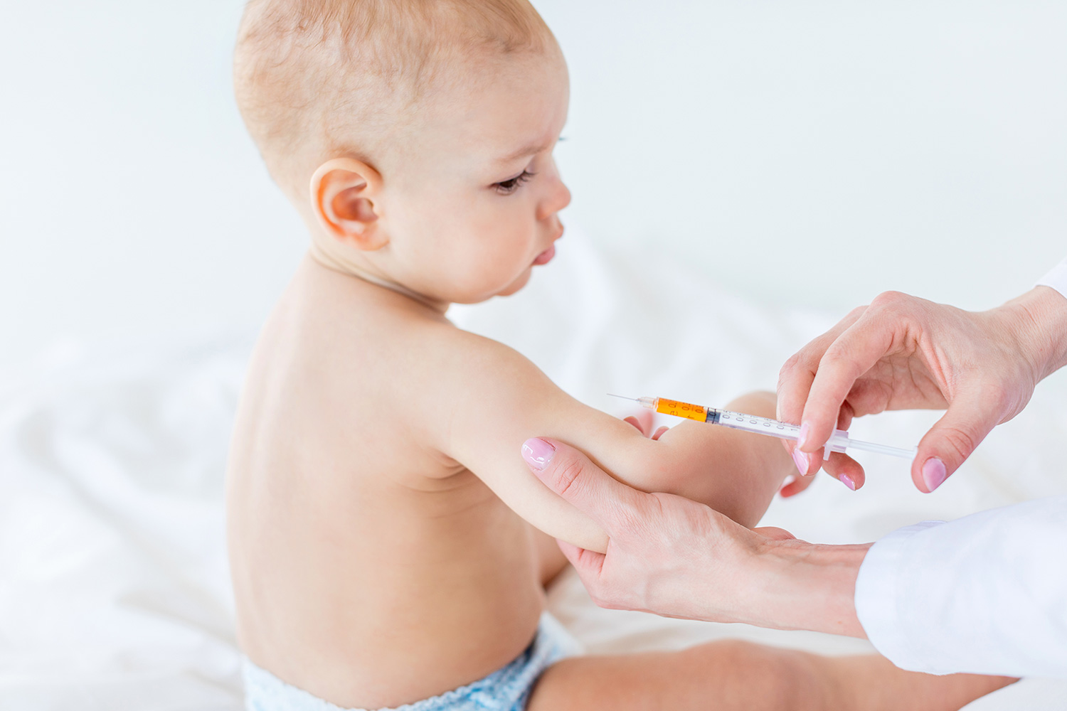 child receiving a vaccine