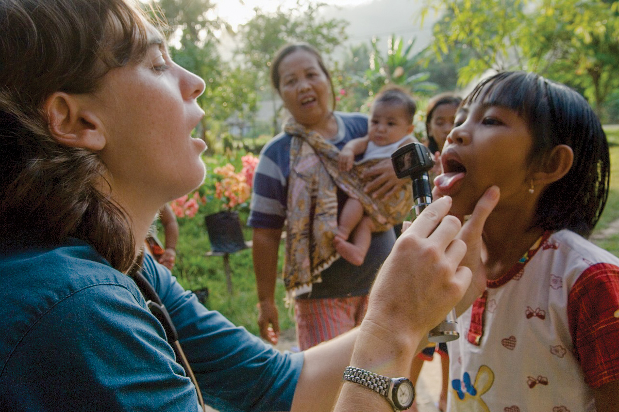 Kinari Webb examines villagers